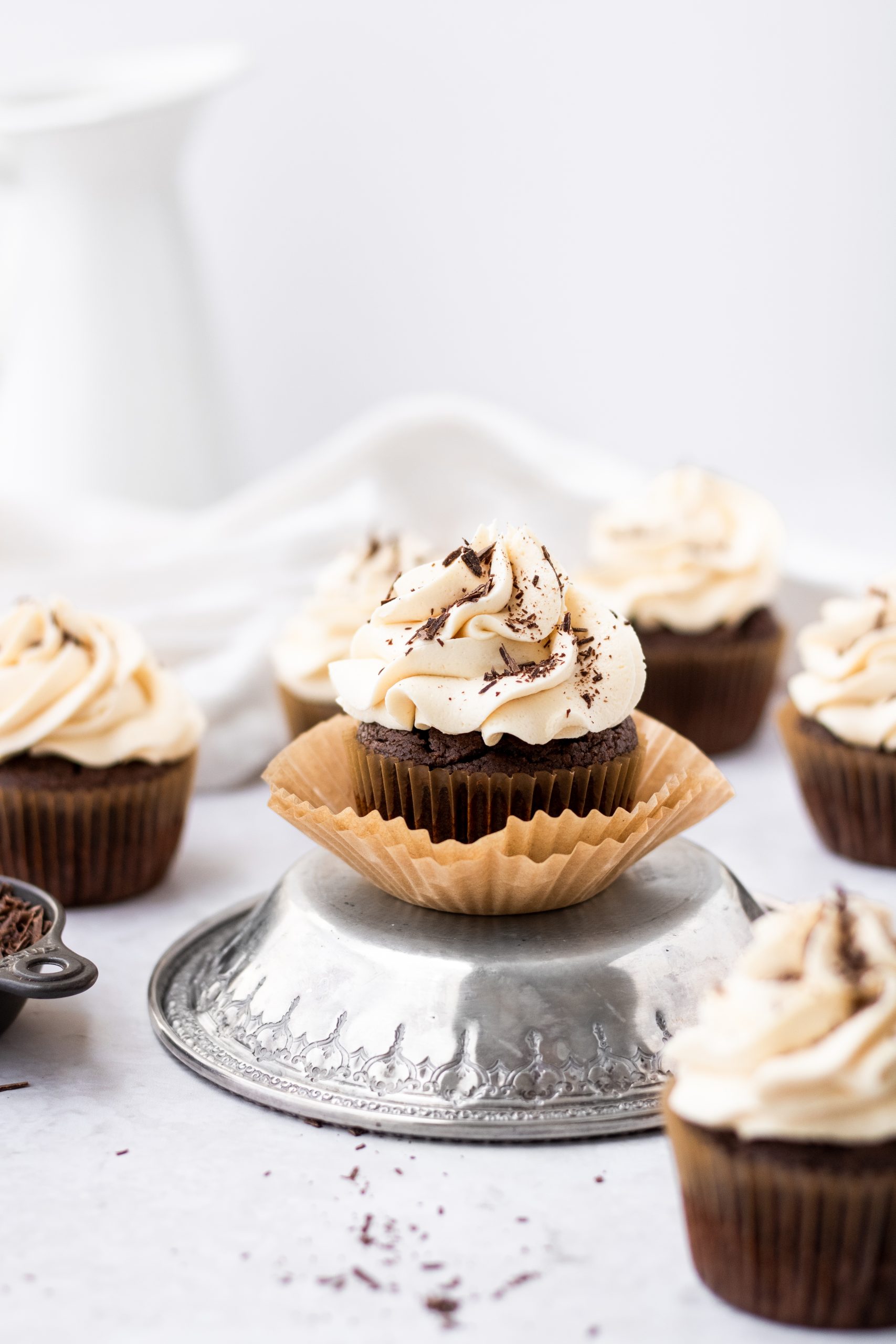 boozy chocolate baileys cupcakes with chocolate shavings to garnish
